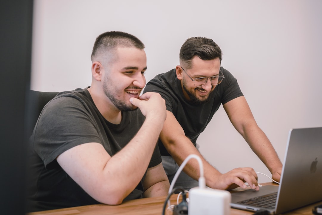 A small agency team reviewing a content calendar, the operational layer that self-hosting adds to the team
